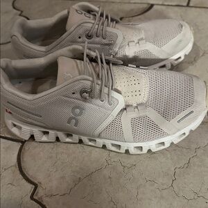 On Running women’s size 5 Athletic sneakers. Left shoe, has small tear forming